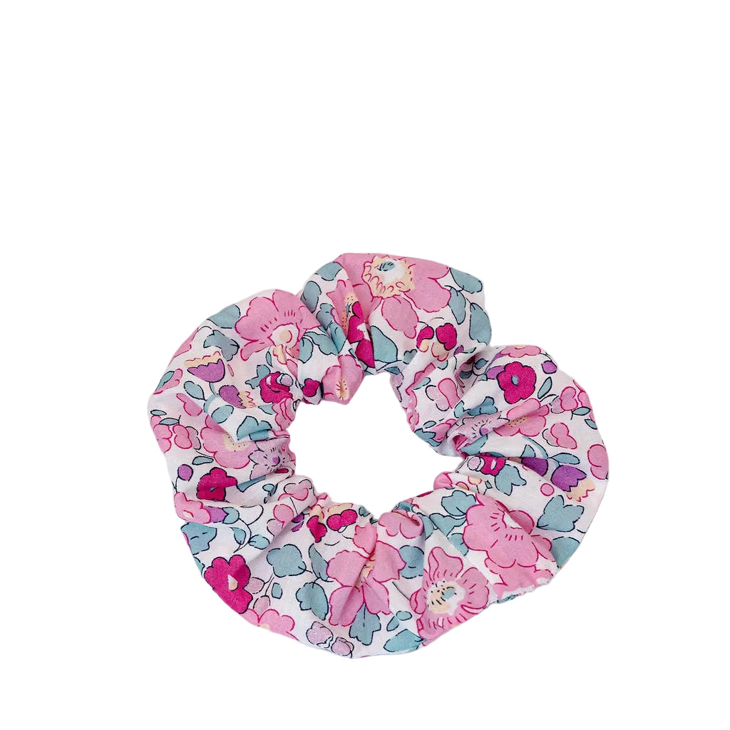 Liberty of London | Betsy MA Cherry Pink Fabric Print Scrunchie.&nbsp; Add a touch of timeless elegance to your hairstyle with this iconic Liberty of London Tana Lawn cotton print scrunchie. This stylised small floral design was designed for Liberty in 1933 and reflects the bold, relaxed style of the era.